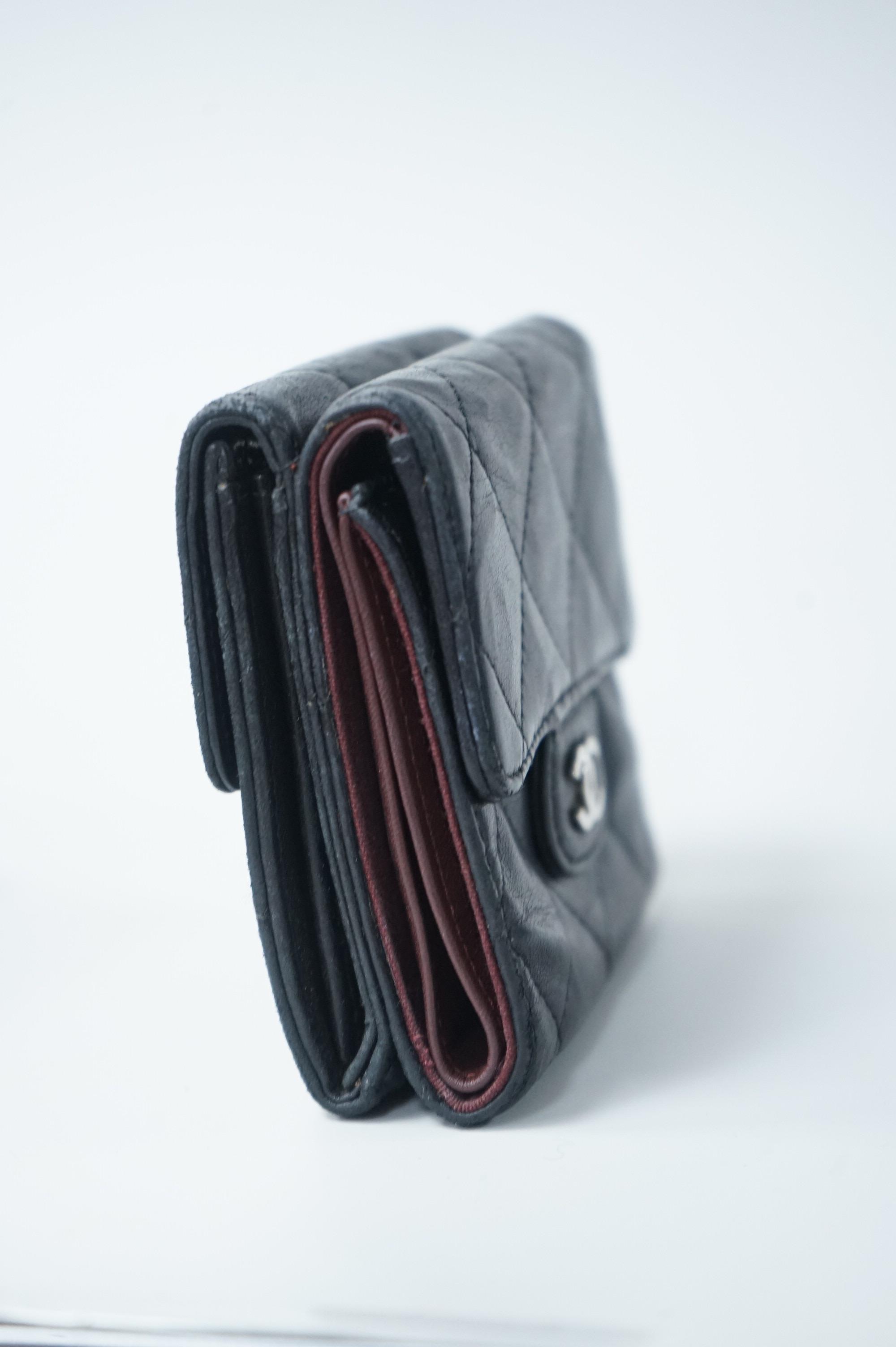 A Chanel classic double flap black leather purse, with original receipt, authenticity card numbered 10670211 and box, 10cm wide, Provenance: Purchased by the vendor in New York